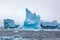 Beautifull big blue iceberg and ocean. Peculiar landscape of Antarctica