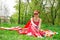 Beautifull happy young woman on green summer grass