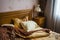 Beautifull linens, pillows and blankets on brown wooden bed and