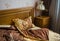 Beautifull linens, pillows and blankets on brown wooden bed and