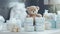 a beautifully arranged stack of baby diapers on a table, accompanied by an adorable toy teddy bear. The scene is set