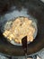 Beautifully chopped fish being fried to be served