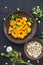 Beautifully chopped pumpkin slices, herbs, and ingredients for the dish.