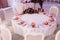 Beautifully decorated guest table, with guest`s names on pomegranate