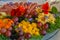 Beautifully decorated home made  salads with edible flowers  on table with different food snacks  party