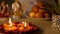 Beautifully decorated puja area with wax Diyas lighted to worship Laxmi-Ganesh