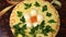 Beautifully decorated salad with eggs and greens for holiday.