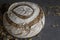 Beautifully decorated sourdough bread on gray background with copy space