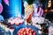 Beautifully decorated table with different cakes and sweets.Ice cream with jam and mint in glasses. Canapes with fruits. A large