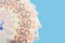 Beautifully folded euro banknotes on a blue background. Financial concept