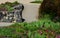 Beautifully folded retaining wall with a granite attic with small joints. brown beige yellow irregular gneiss stone holding a slop