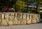Beautifully folded retaining wall with a granite attic with small joints. brown beige yellow irregular gneiss stone holding a slop