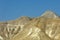 Beautifully lit mountain ridge with all its contours, colors and baldness in the evening sun of the Judea desert in Israel