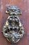Beautifully ornate traditional brass door knocker, symbol of welcome