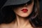 Beautifully painted red lips on the girl`s face. Model in a black hat
