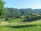 Beautifully panorama view with a turquoise blue sky, green mountains and vineyards