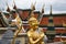 Beautifully stunning gold statue of a Kinnara, a beloved mythical half-human, half-bird creature on the Upper Terrace of Wat Phra