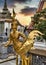 Beautifully stunning gold statue of a Kinnara, a beloved mythical half-human, half-bird creature on the Upper Terrace of Wat Phra