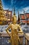 Beautifully stunning gold statue of a Kinnara, a beloved mythical half-human, half-bird creature on the Upper Terrace of Wat Phra