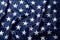 Beautifully waving stars of American flag close up background.