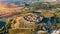 Beautiul aerial view of Monteriggioni, Tuscany medieval town on the hill. Tuscan scenic landscape vista with ancient walled city