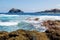 Beautiul seascape on Tenerife island. Rocks with algae, clear blue water and waves of Atlantic ocean. Tenerife, Canary island,