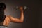 Beautuful hispanic woman workout with dumbbells studio portrait