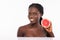 Beauty african woman with orange citrus grapefruit with healthy skin body. Attractive fresh vitamin. Studio shot