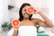 Beauty african woman with orange citrus grapefruit with healthy skin body. Attractive fresh vitamin. Studio shot.