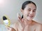 Beauty asian woman applying makeup with Sponge Powder Puff. woman make up herself