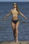 beauty athletic woman in a swimsuit on the beach