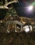 the beauty of the bamboo house at night which is lit by several lights