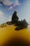 The beauty of the beach with cliffs, waves and trees on Karang Agung beach, Kebumen, Central Java, Indonesia