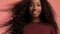 Beauty black mixed race african american woman with long curly hair and perfect smile