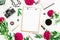 Beauty blog concept. Blogger or freelancer workspace with clipboard, notebook, retro camera, peonies and coffee mug on white backg