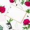 Beauty blog concept. Blogger or freelancer workspace with clipboard, notebook, retro camera, peonies and pen on white background.