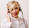 Beauty blond woman with headphones, call operator