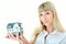 Beauty blonde woman with little house on hand