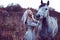 beauty blondie with horse in the field, effect of toning