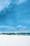 Beauty blue sea , bridge and white sand with blue sky. A Pier, stone bridge over the sea