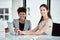 Beauty and brains - they have both. Portrait of two businesswomen using a laptop together in an office.