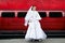 Beauty bride on background red limo car