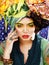 Beauty bright woman with creative make up, many shawls on head l