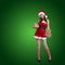 Beauty Christmas fashion model girl in Christmas dress holding gift boxes