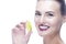 Beauty Closeup Portrait of Cute Winsome  Caucasian Girl Holding Lemon Slice In Front of Her Mouth While Posing Against Pure White