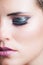 Beauty closeup of woman face with glittering eyeshadow