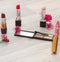 Beauty cosmetic table, toilet, with cosmetic bottles, lipstick and flower. Top view