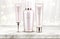 Beauty cosmetics bottles line on marble table top