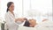 Beauty and cosmetology image of young woman face having face massage in spa salon.