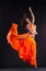 Beauty dancer jump in orange veil - arabian style